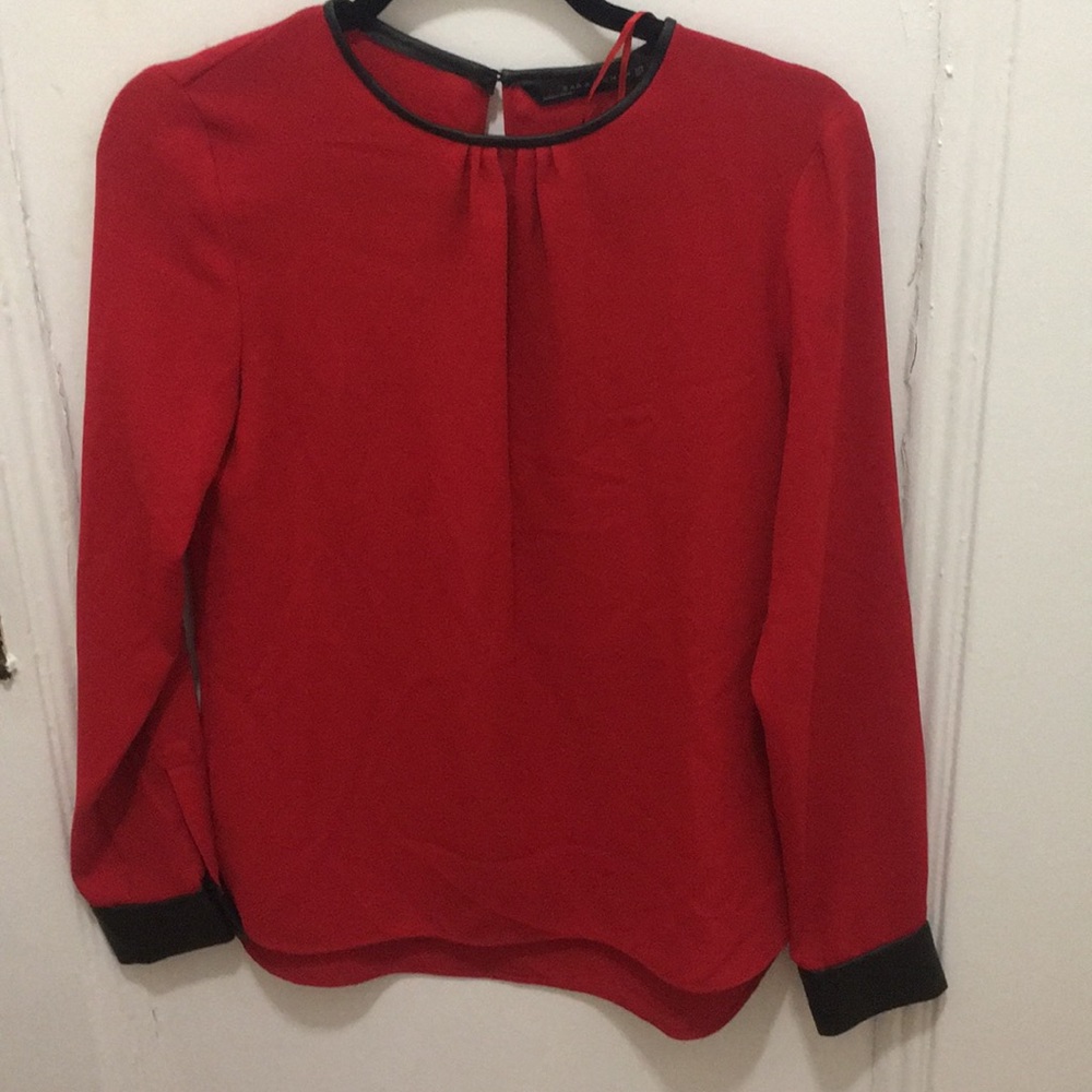 Red blouse with leather cuffs and neck
